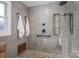 Modern glass enclosed shower with a rain shower head and decorative tile at 108 N Oakwood Dr, Kings Mountain, NC 28086