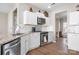 Bright kitchen showcases granite countertops, stainless steel appliances, and crisp white cabinetry at 12419 Swan Wings Pl, Huntersville, NC 28078