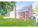 Brick house with chimney, and green lawn, surrounded by wooden fence at 136 Ole Eastpointe Dr, York, SC 29745