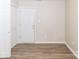 Bedroom features hardwood floors, white door, and neutral colored walls at 136 Ole Eastpointe Dr, York, SC 29745