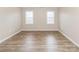 Neutral bedroom with flooring and two bright windows at 136 Ole Eastpointe Dr, York, SC 29745