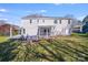 A home's backyard features a pergola, back deck, and well-maintained landscaping at 13732 Strathaven Dr, Matthews, NC 28105