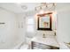 Bathroom with a shower and bathtub combo, a vanity, and neutral-toned walls and fixtures at 13732 Strathaven Dr, Matthews, NC 28105