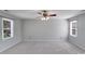 Spacious bedroom with neutral carpet, two windows and neutral paint at 13732 Strathaven Dr, Matthews, NC 28105