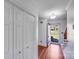 Hallway with hardwood floors, neutral paint, and access to the main floor at 13732 Strathaven Dr, Matthews, NC 28105