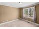 Clean bedroom features a window and neutral color scheme at 147 Pearl Bay Dr, New London, NC 28127