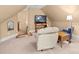 Attic bedroom with recliner, side table, and flat screen television at 147 Pearl Bay Dr, New London, NC 28127