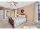 Cozy bedroom boasts carpet floors, neutral paint and a large window at 147 Pearl Bay Dr, New London, NC 28127