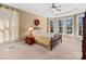 Bright bedroom with tray ceilings, hardwood floors and large windows with lake views at 147 Pearl Bay Dr, New London, NC 28127