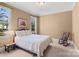 Cozy bedroom boasts neutral walls, a window, and traditional decor at 147 Pearl Bay Dr, New London, NC 28127