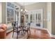 Bright dining area with hardwood floors, glass doors, and views of the outdoors at 147 Pearl Bay Dr, New London, NC 28127