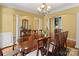 Spacious formal dining room with an elegant chandelier and large table at 147 Pearl Bay Dr, New London, NC 28127