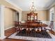 Formal dining room boasts hardwood floors, chair rail and decorative light fixture at 147 Pearl Bay Dr, New London, NC 28127