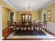 Elegant dining room with chandelier, hutch, and large windows at 147 Pearl Bay Dr, New London, NC 28127