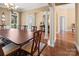 Formal dining room boasts hardwood floors, classic columns, elegant lighting, and detailed millwork at 147 Pearl Bay Dr, New London, NC 28127