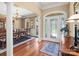 Elegant foyer with hardwood floors, decorative lighting, and a view into the formal dining room at 147 Pearl Bay Dr, New London, NC 28127