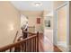 Hallway has hardwood floors and offers seamless flow and access to multiple rooms at 147 Pearl Bay Dr, New London, NC 28127