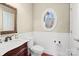 Powder room featuring a decorative mirror and unique oval window at 147 Pearl Bay Dr, New London, NC 28127
