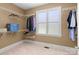 Spacious walk-in closet features wire shelving and a window for natural light at 147 Pearl Bay Dr, New London, NC 28127