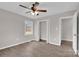 Charming bedroom featuring a ceiling fan and a window allowing natural light at 155 Country Ln, Mooresville, NC 28115