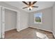 Cozy bedroom featuring new floors, closet, and a window with a view at 155 Country Ln, Mooresville, NC 28115