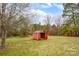 View of red shed in backyard on a sunny day at 155 Country Ln, Mooresville, NC 28115