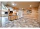 Basement kitchenette with wood cabinets, granite countertops, refrigerator, and tile flooring at 1790 Faires Rd, Rock Hill, SC 29730