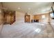 Finished basement boasting light wood paneling, recessed lights, carpet, and staircase at 1790 Faires Rd, Rock Hill, SC 29730