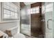 Bathroom with glass door shower and toilet with window at 1790 Faires Rd, Rock Hill, SC 29730