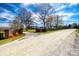 Grand entrance with brick pillars and wrought iron gates leading to Twin Spin Ranch at 1790 Faires Rd, Rock Hill, SC 29730