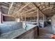 Spacious horse stalls inside a wooden barn, offering ample room and shelter at 1790 Faires Rd, Rock Hill, SC 29730