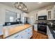 Bright and modern kitchen with stainless steel appliances, butcher block island, and an open layout at 1790 Faires Rd, Rock Hill, SC 29730