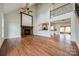 Inviting living room featuring vaulted ceilings, hardwood floors, a fireplace and an open floor plan at 1790 Faires Rd, Rock Hill, SC 29730