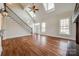 Bright living room with hardwood floors, skylights, staircase, and large windows, offering plenty of natural light at 1790 Faires Rd, Rock Hill, SC 29730