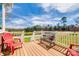 Inviting porch with picturesque views of the surrounding landscape and seating at 1790 Faires Rd, Rock Hill, SC 29730