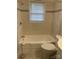 Clean, updated bathroom with neutral tile, a well-maintained tub, and modern fixtures at 213 Crowell Ave, Albemarle, NC 28001