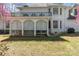 Spacious backyard featuring a covered patio and a balcony with decorative railings at 2430 Berkshire Dr, Salisbury, NC 28146