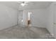 Neutral bedroom with open doorway to bath and hall, plush carpet, and ample light at 2430 Berkshire Dr, Salisbury, NC 28146