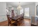 Elegant dining room with wood floors, chandelier, and ample seating at 2430 Berkshire Dr, Salisbury, NC 28146