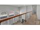 Hallway with wood railing and lots of windows at 2430 Berkshire Dr, Salisbury, NC 28146