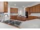 Kitchen features custom wood cabinets and modern appliances at 2430 Berkshire Dr, Salisbury, NC 28146