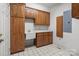 Functional laundry room with plenty of storage, sink and tile flooring at 2430 Berkshire Dr, Salisbury, NC 28146