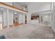 Open-concept living room with staircase and view of kitchen area at 2430 Berkshire Dr, Salisbury, NC 28146