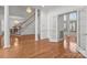 Bright and airy living room featuring hardwood floors, white columns, and an open doorway at 2430 Berkshire Dr, Salisbury, NC 28146