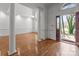 Spacious living room featuring hardwood floors, white columns, and a front door view at 2430 Berkshire Dr, Salisbury, NC 28146