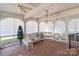 Cozy screened porch with wicker furniture and vintage brick floors at 2430 Berkshire Dr, Salisbury, NC 28146