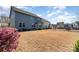 Spacious backyard showcasing a large, grassy area and mature landscaping at 3034 Oakmere Rd, Waxhaw, NC 28173