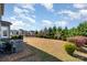 Expansive backyard featuring well-maintained lawn, mature trees, and play area at 3034 Oakmere Rd, Waxhaw, NC 28173