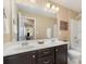 This bathroom features a double sink vanity, toilet, a shower/tub, and a large mirror at 3034 Oakmere Rd, Waxhaw, NC 28173