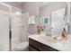 Clean bathroom featuring a glass shower, single sink vanity, and neutral decor at 3034 Oakmere Rd, Waxhaw, NC 28173